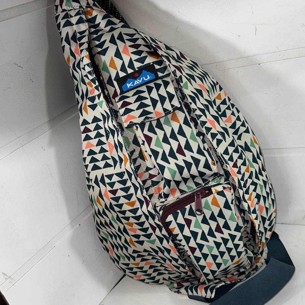 Kavu Geometric Triangle Sling Backpack in Cream, Black, Orange, Green, Navy